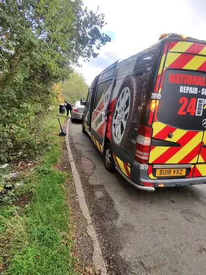 TyreGO van parked behind a car during a roadside tyre call-out